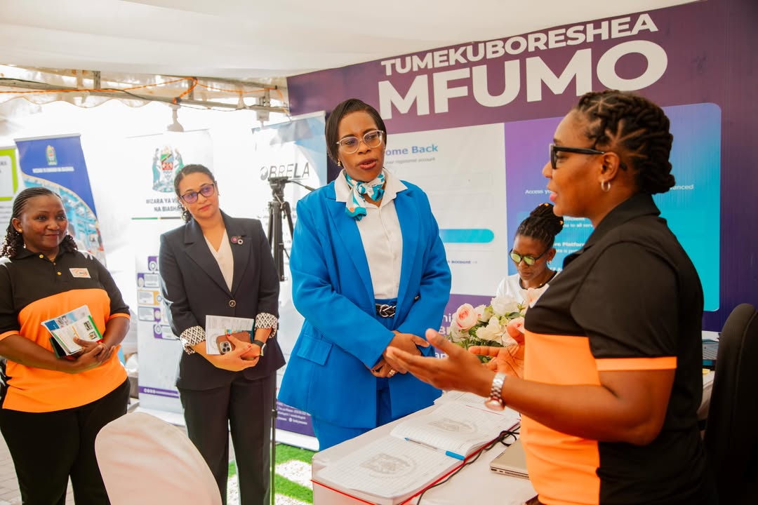 Visitors at the CBE booth receiving academic information